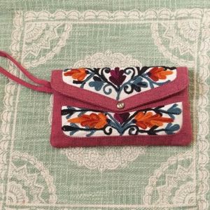 Pink embroidered floral wristlet